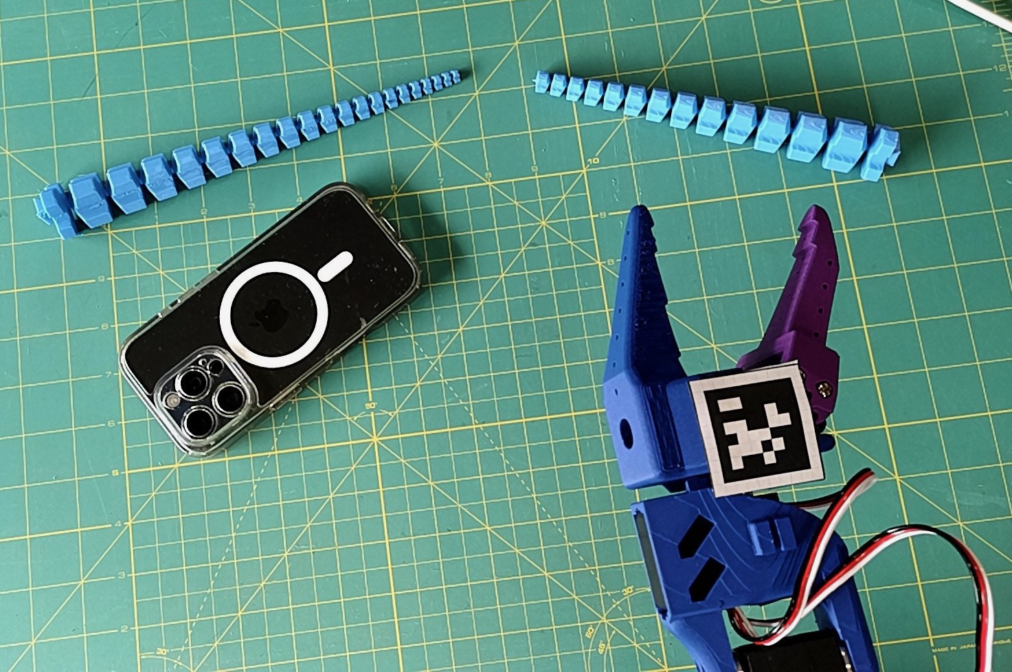 The camera's view of a phone, my tentacle, and my arm